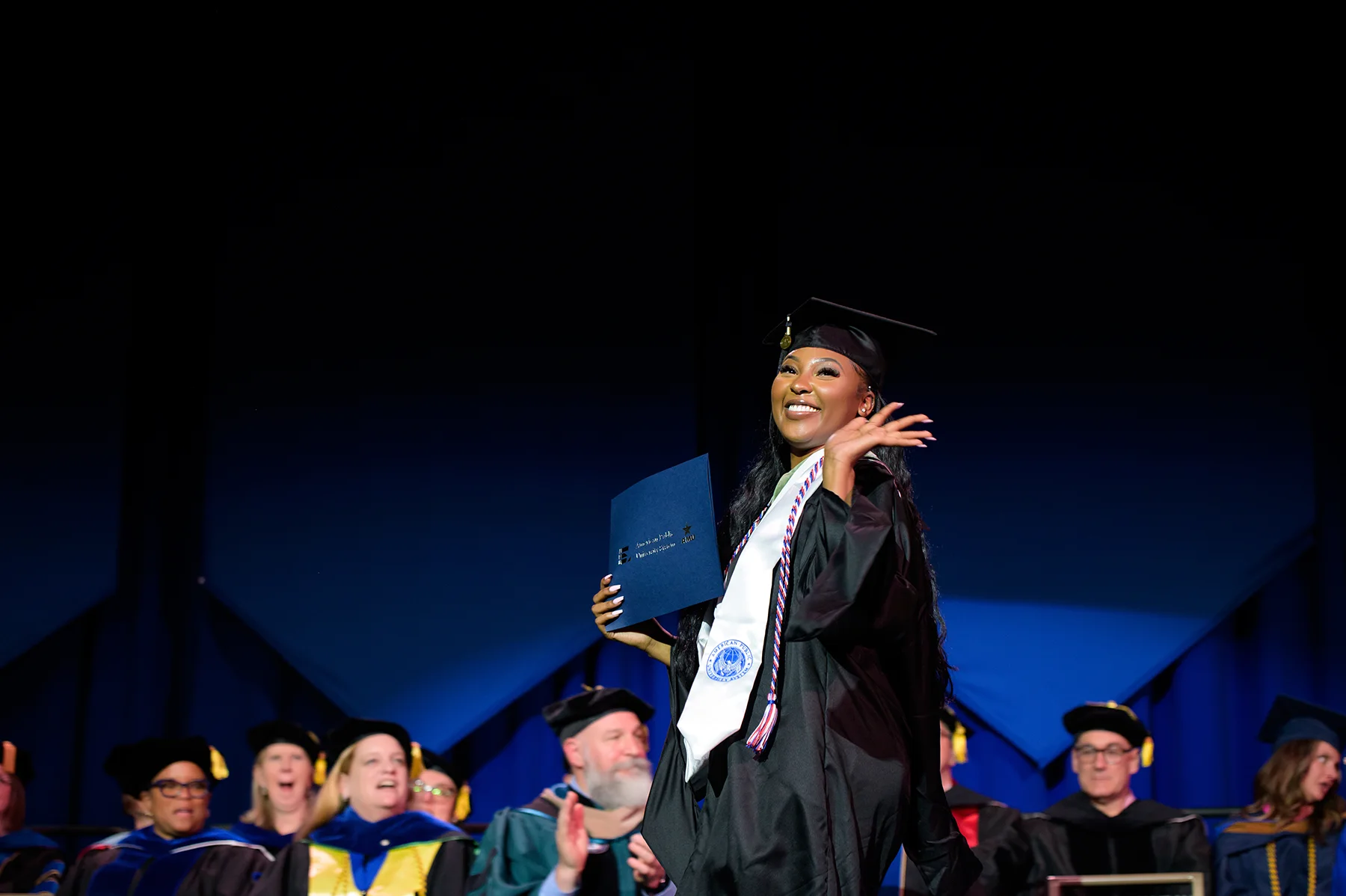 Women Walking Across Stage 